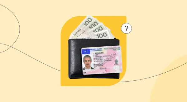 Portfel z polskim prawem jazdy i banknotami 100 zł.